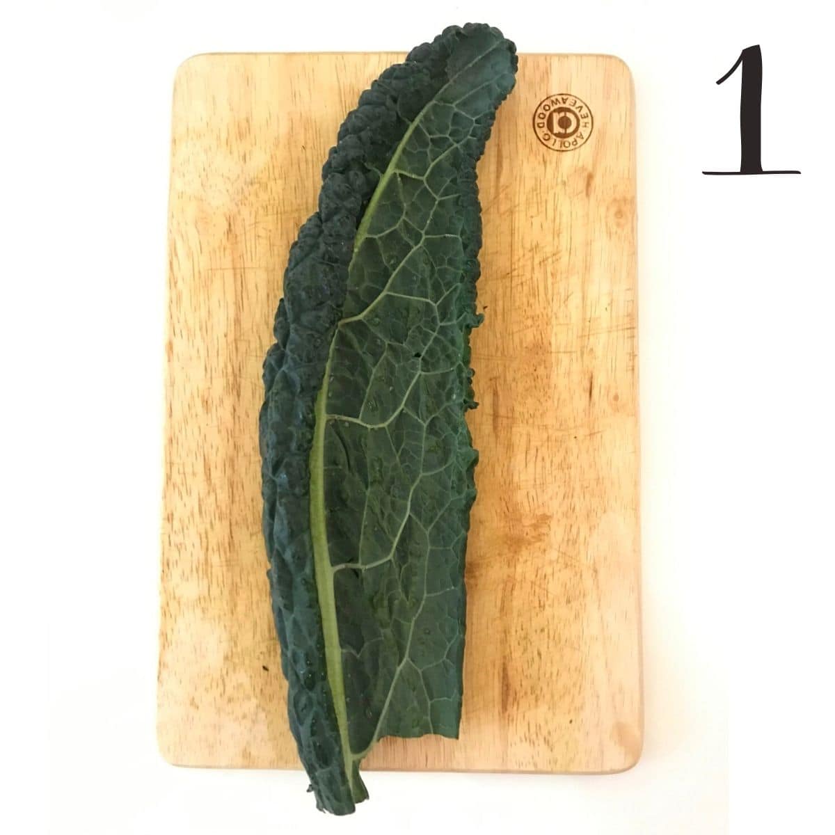 Cavolo nero leaf on chopping board.