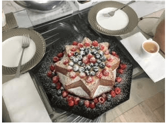 Readers pandoro filled with Italian custard and topped with berries.