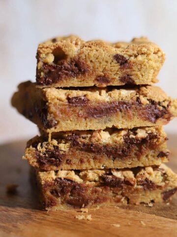 Image of stack of four chocolate chip blondies.