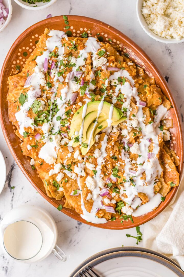 Image of chilaquiles rojos in a large serving dish.