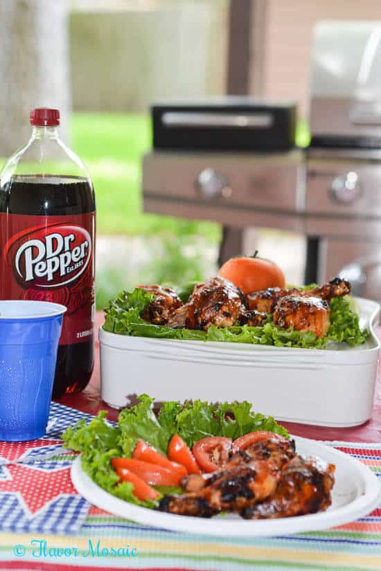Image of grilled chicken with sauce and salad alongside bottle of Dr Pepper.