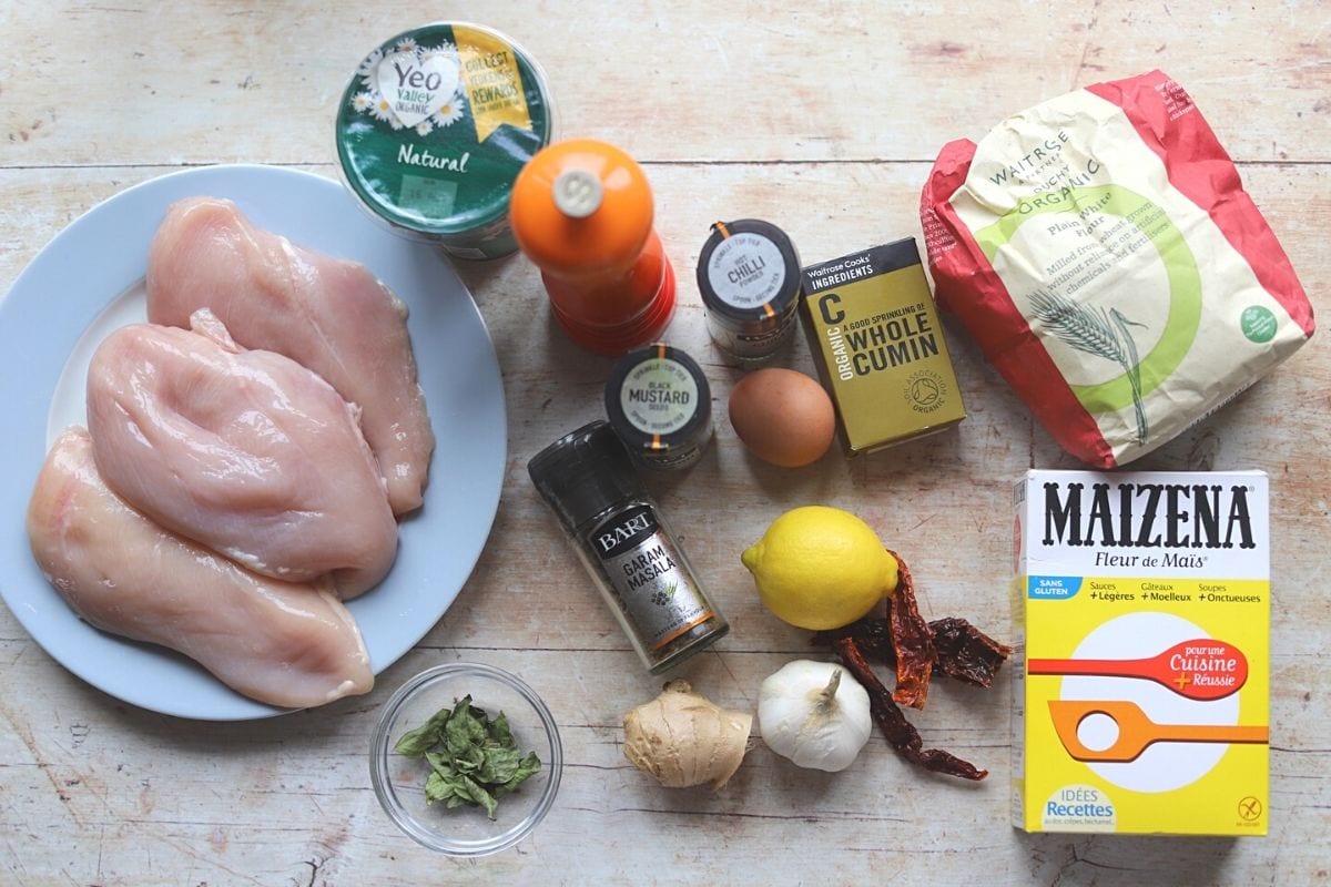 All the ingredients for chicken 65 laid out on a table.