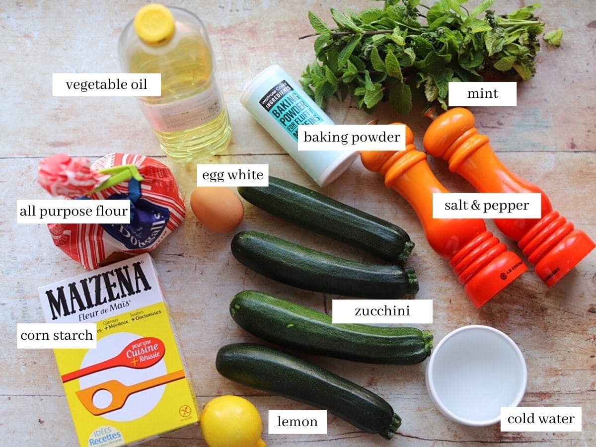 All the ingredients used in the recipe on a wooden worktop.