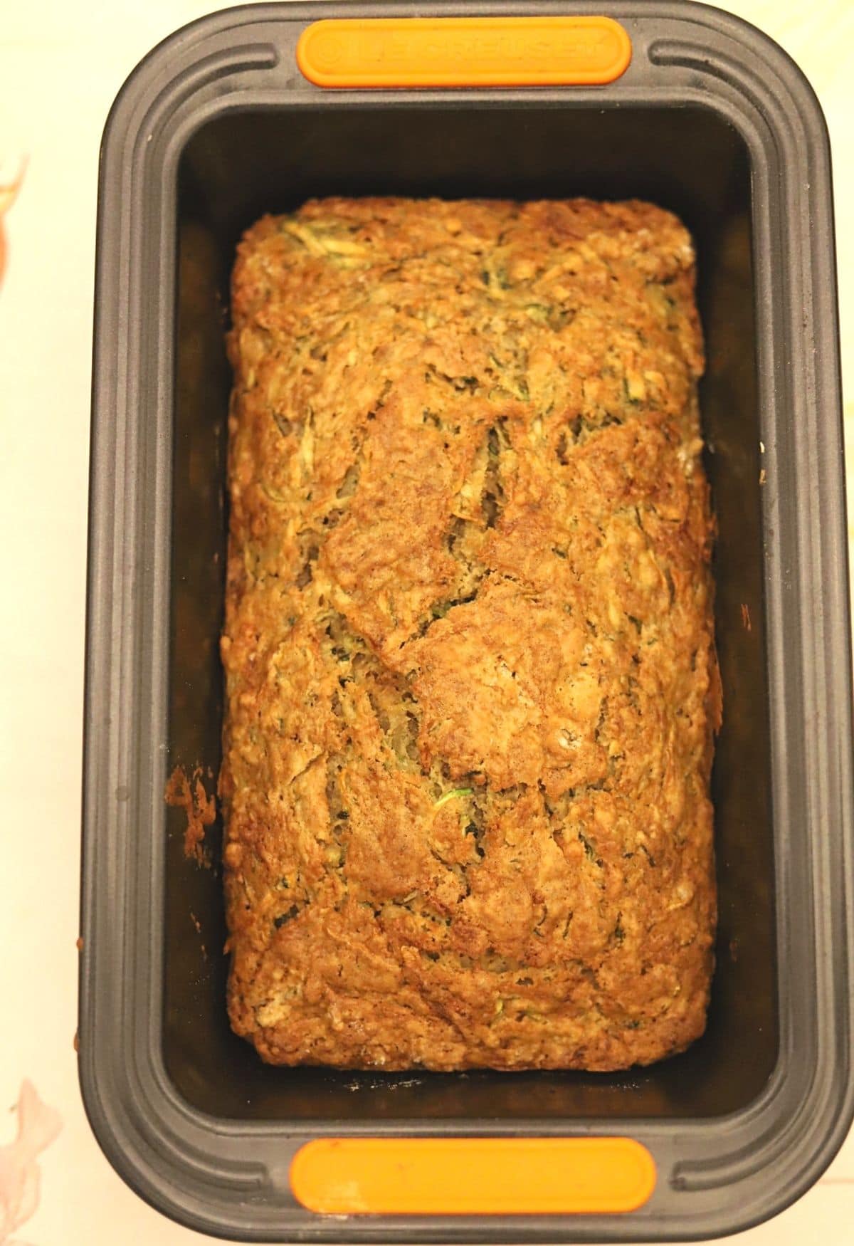 Freshly baked zucchini bread in tin.