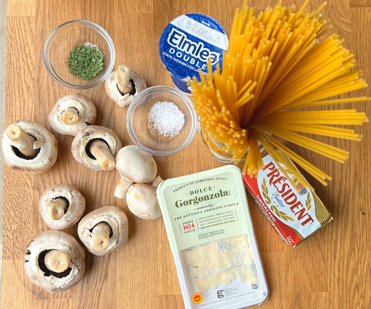 Ingredients on table for pasta gorgonzola.
