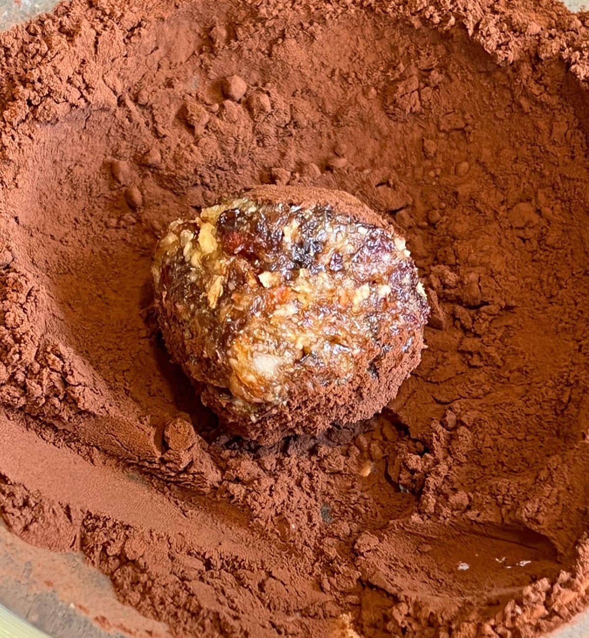 Bliss ball in cocoa powder.
