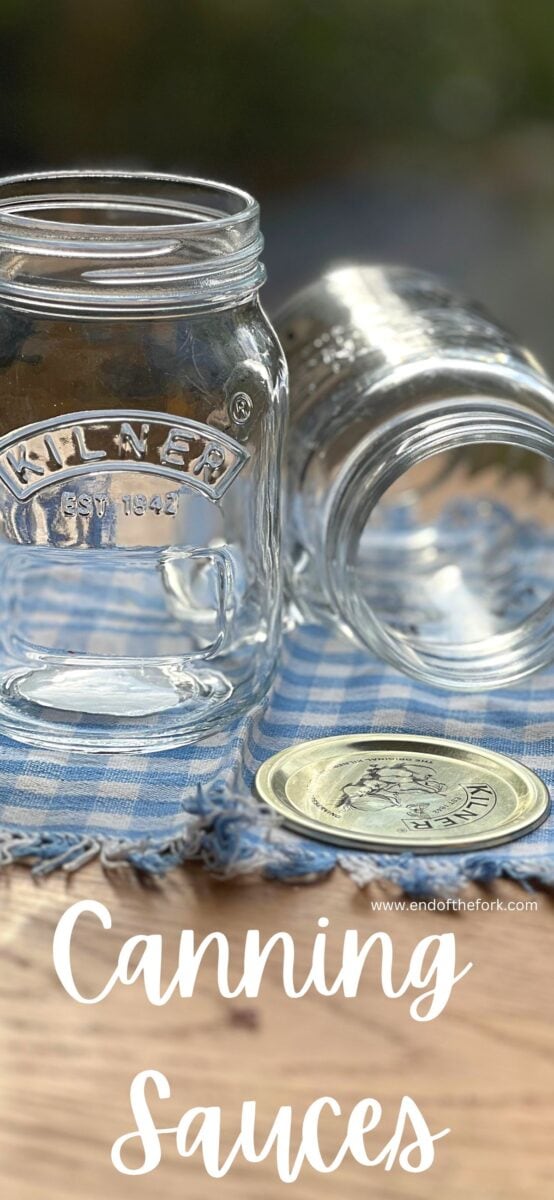 Pin image of empty canning glass jars.