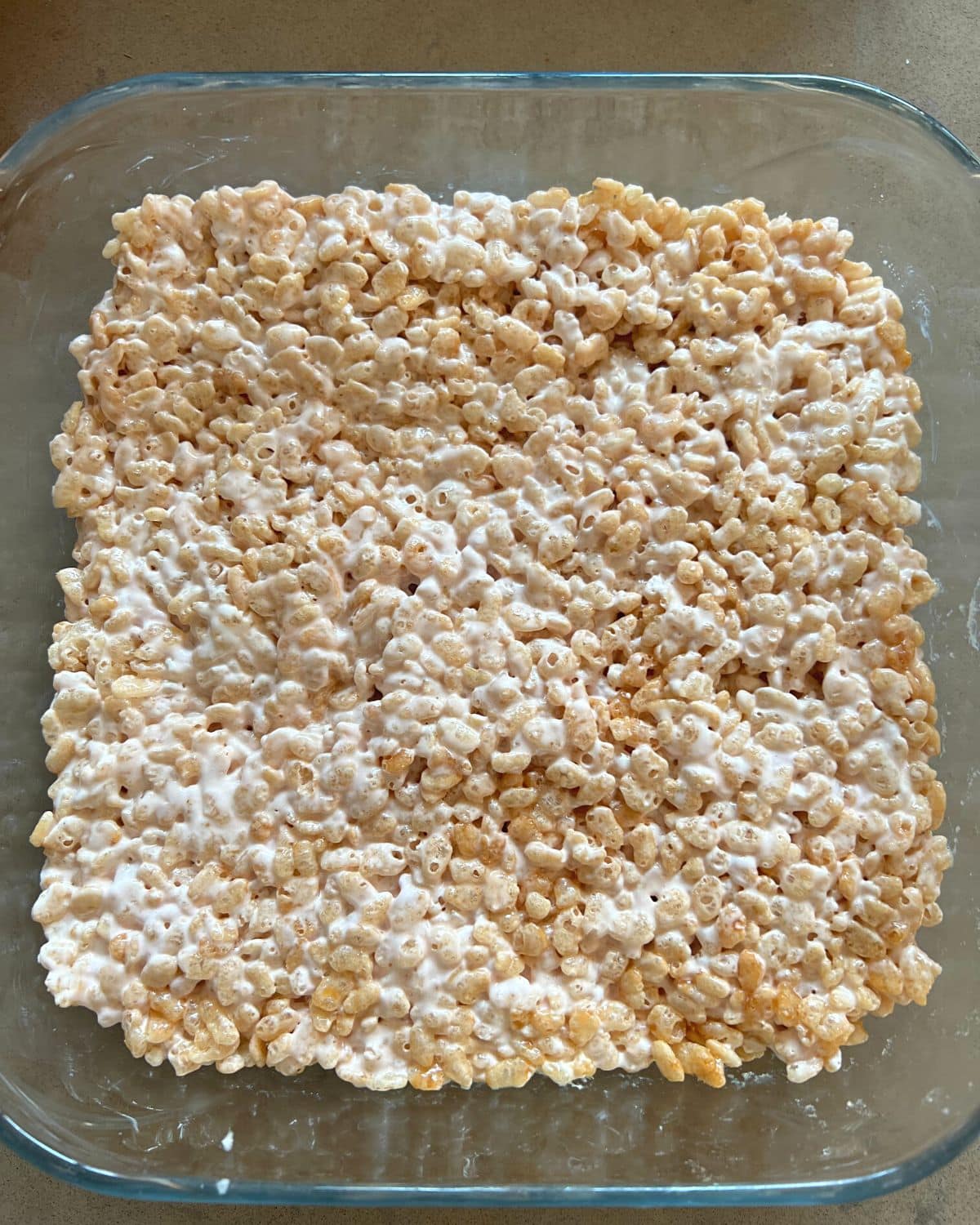 Rice krispies and marshmallows in a glass dish.
