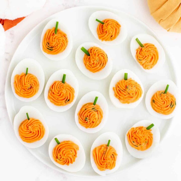 Devilled eggs with orange filling to look like pumpkins.