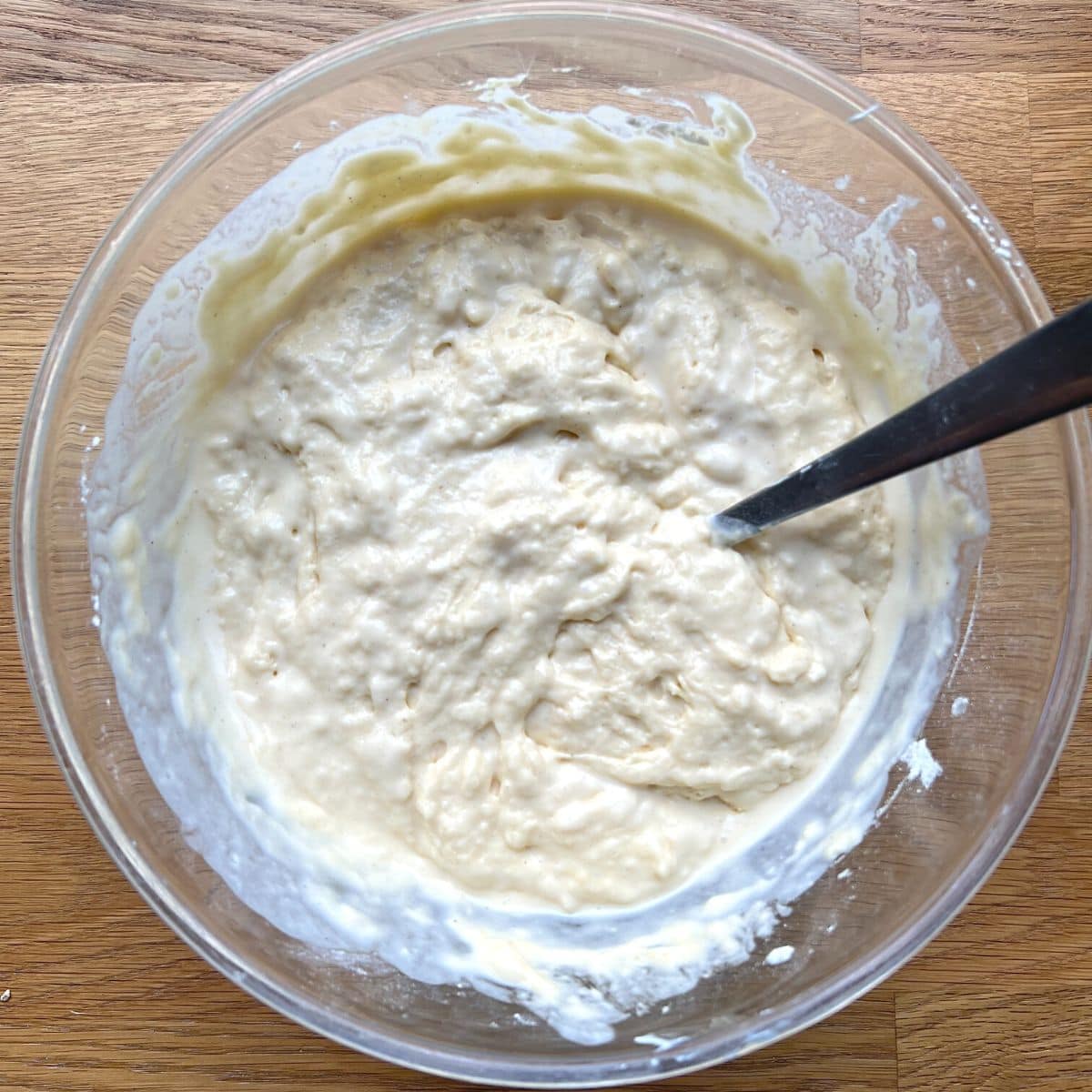 Pancake batter in glass bowl.