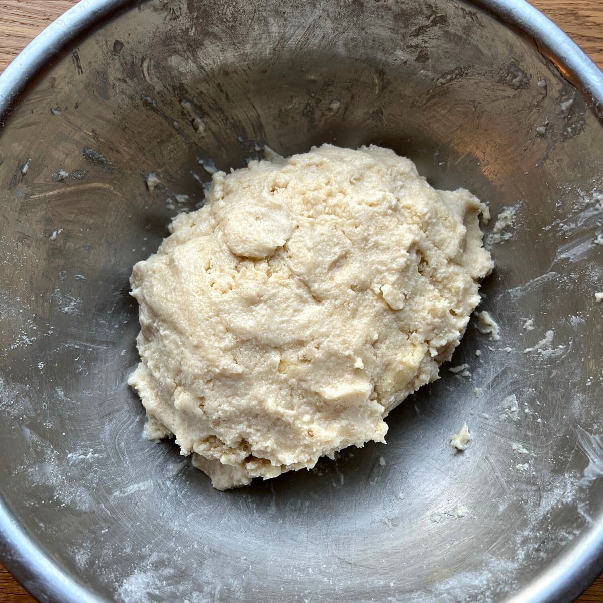 Biscuit dough in mixing bowl.