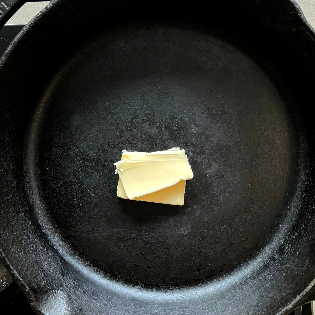 Butter in cast iron skillet.
