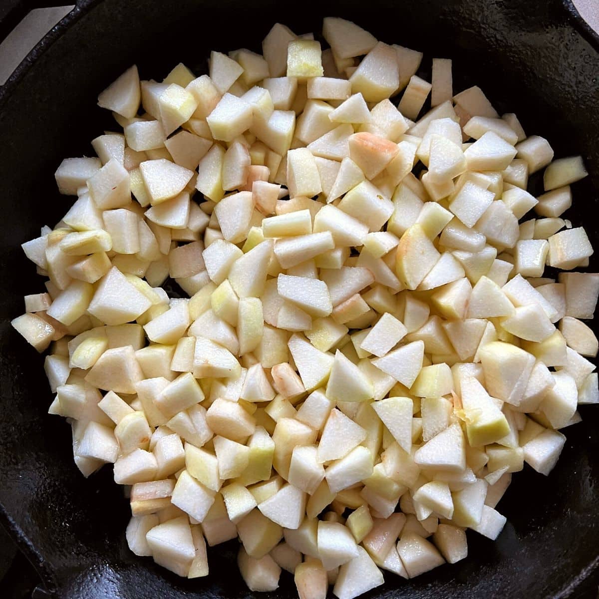 Cut pears in skillet.