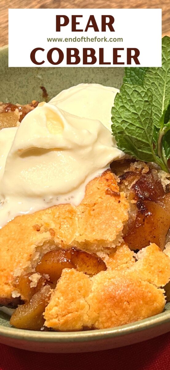 Close up of pear cobbler with ice cream.