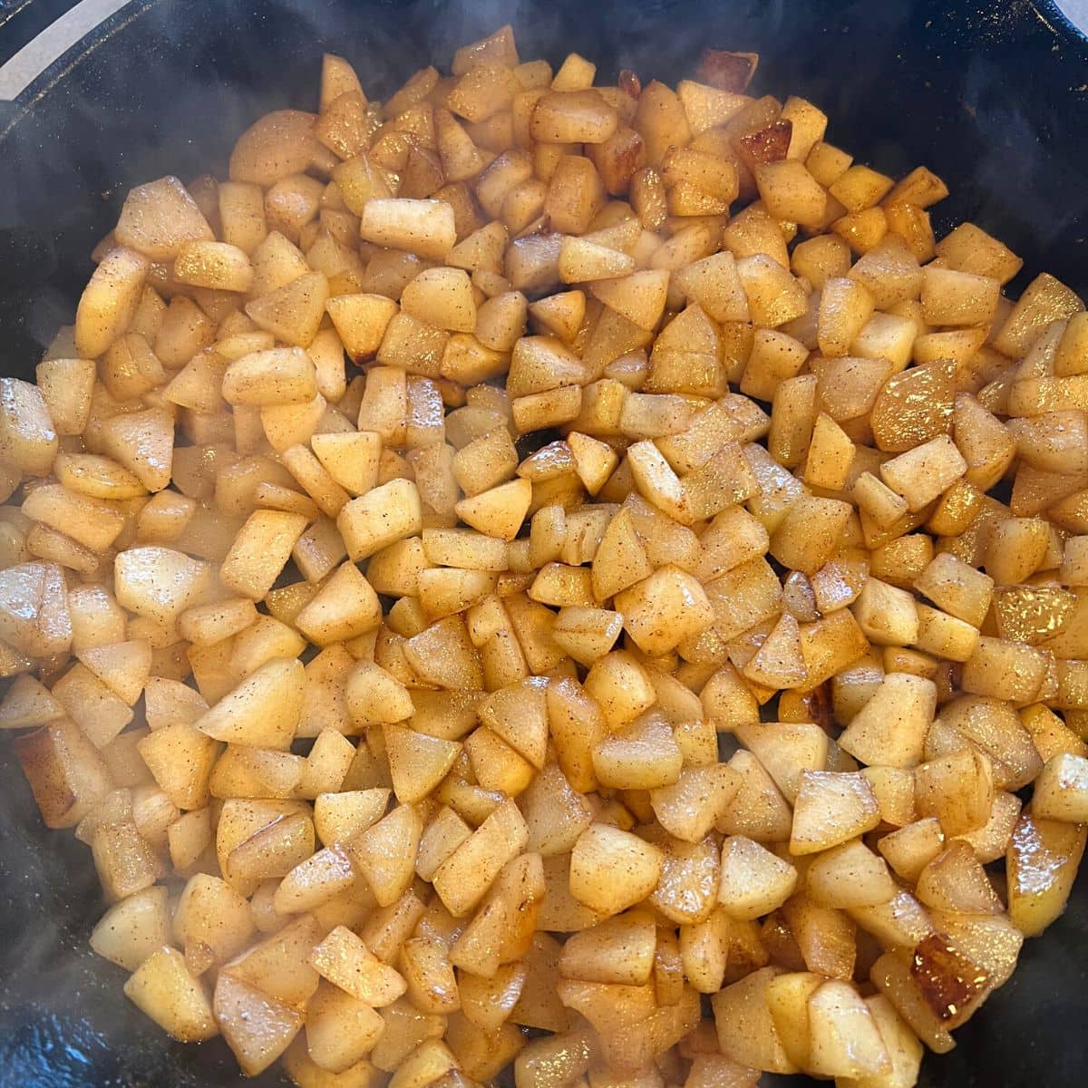 Pears caramelizing in skillet.