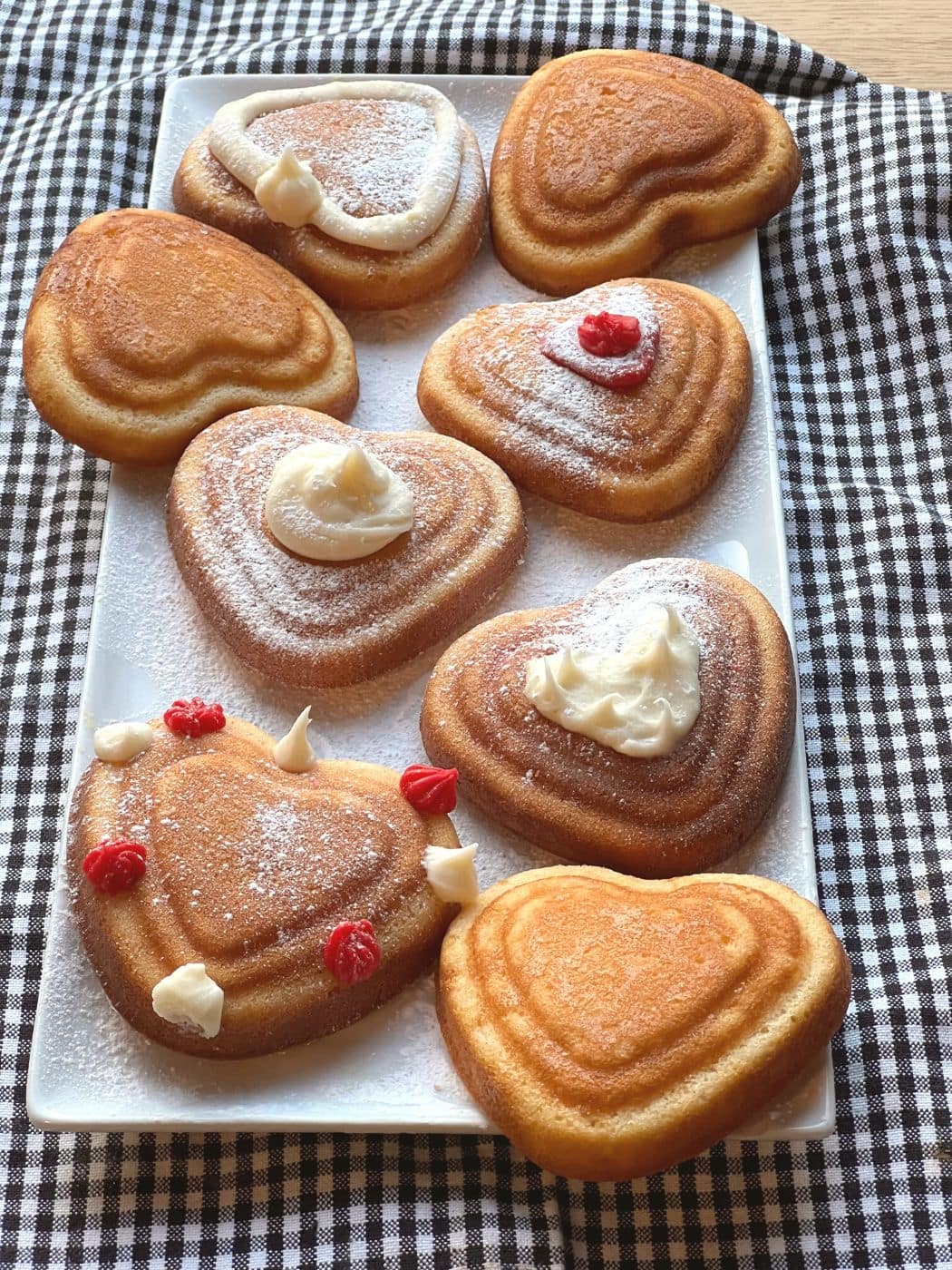 Decorated mini heart cakes.