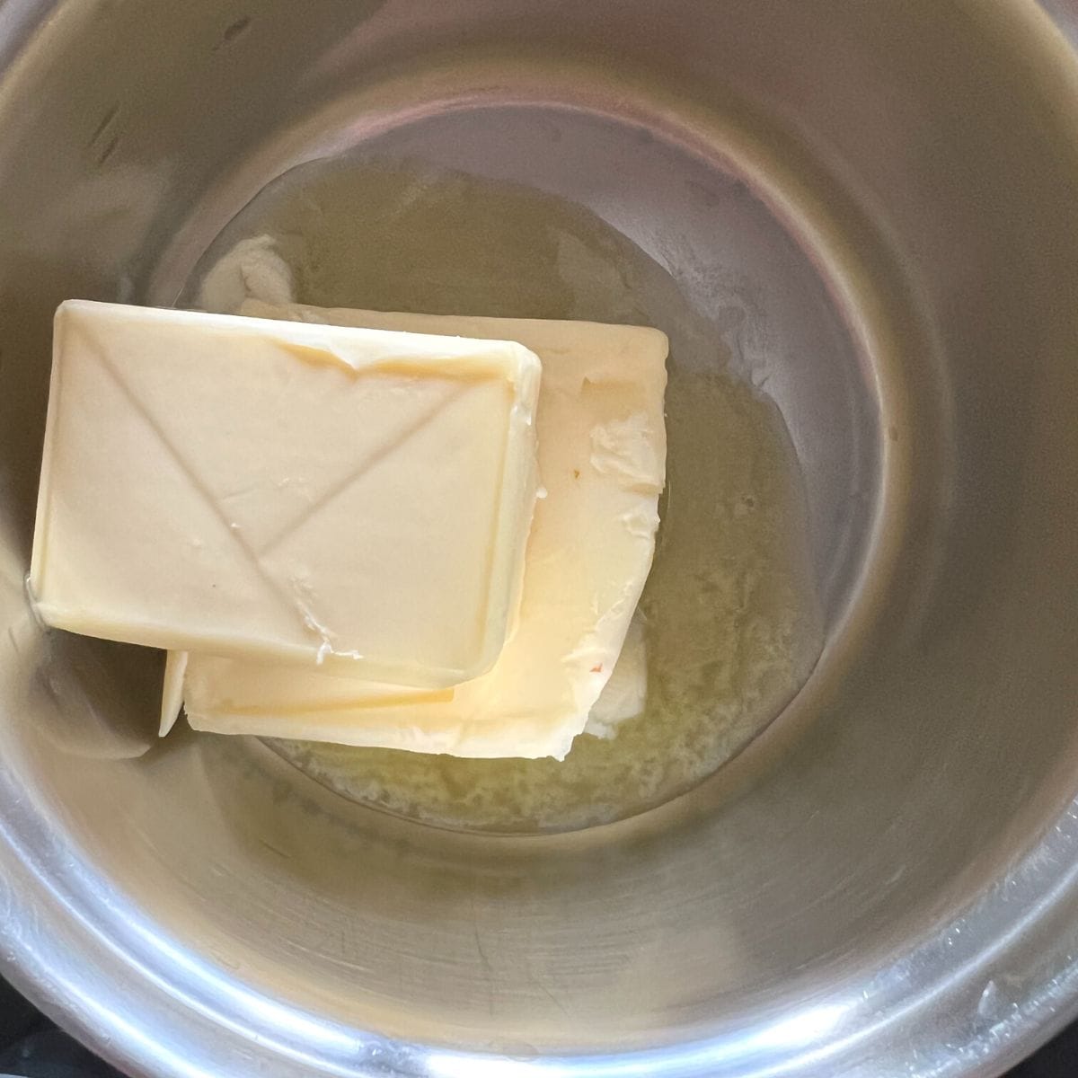 Melting butter in small saucepan.