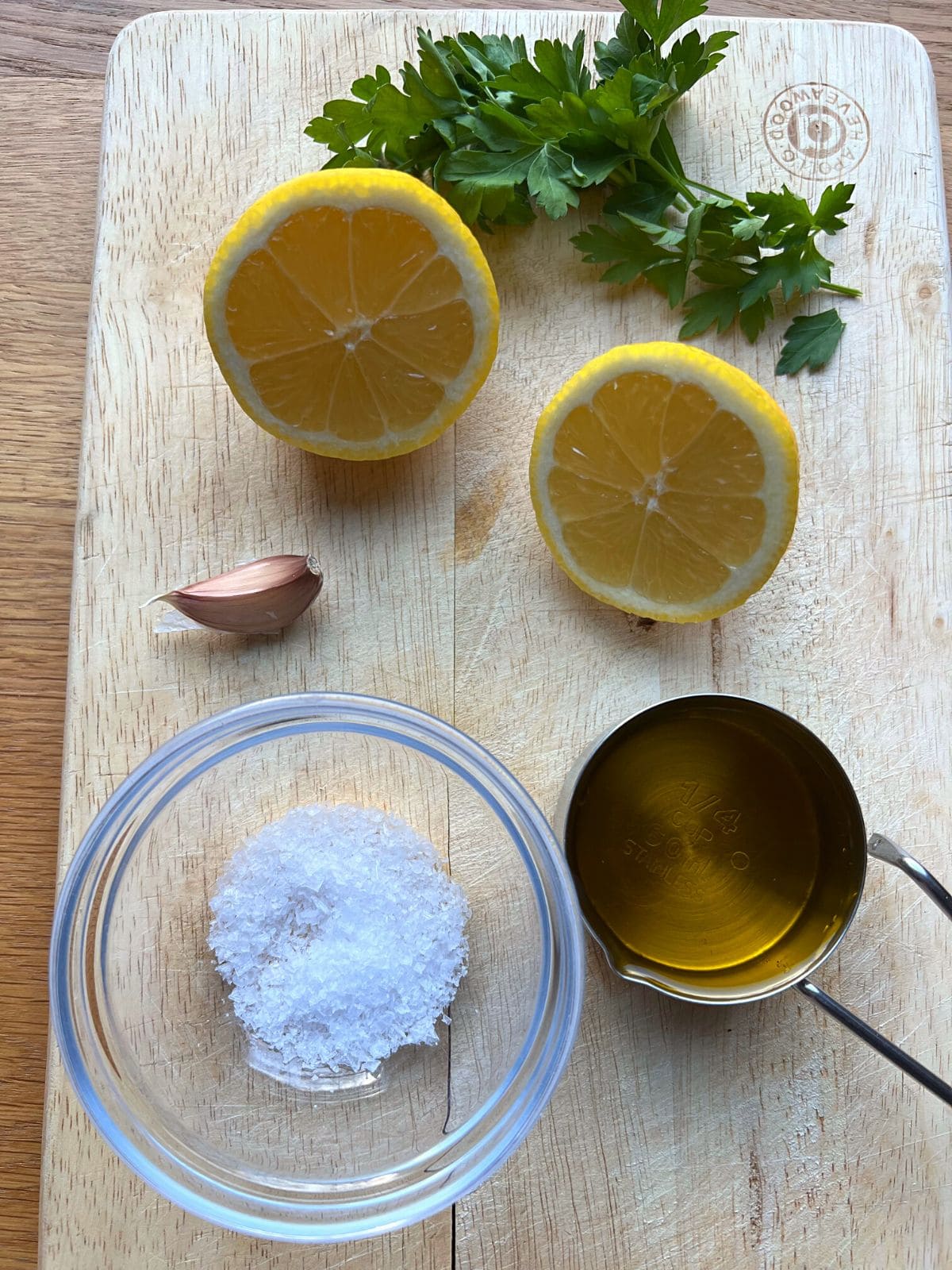 Ingredients for dressing on wooden board.