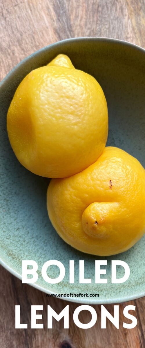Pin image of boiled lemons in green bowl.