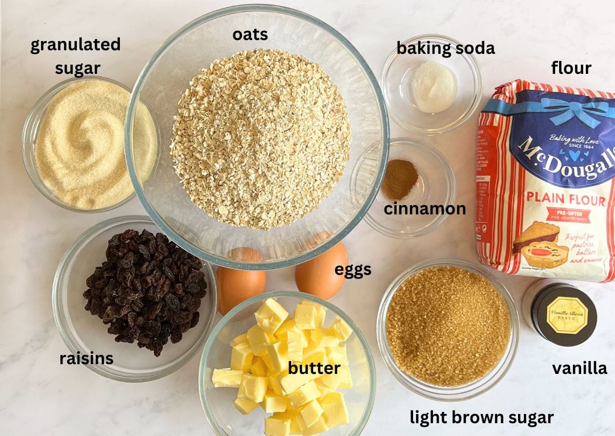 Oatmeal raisin cookie ingredients in small bowls.