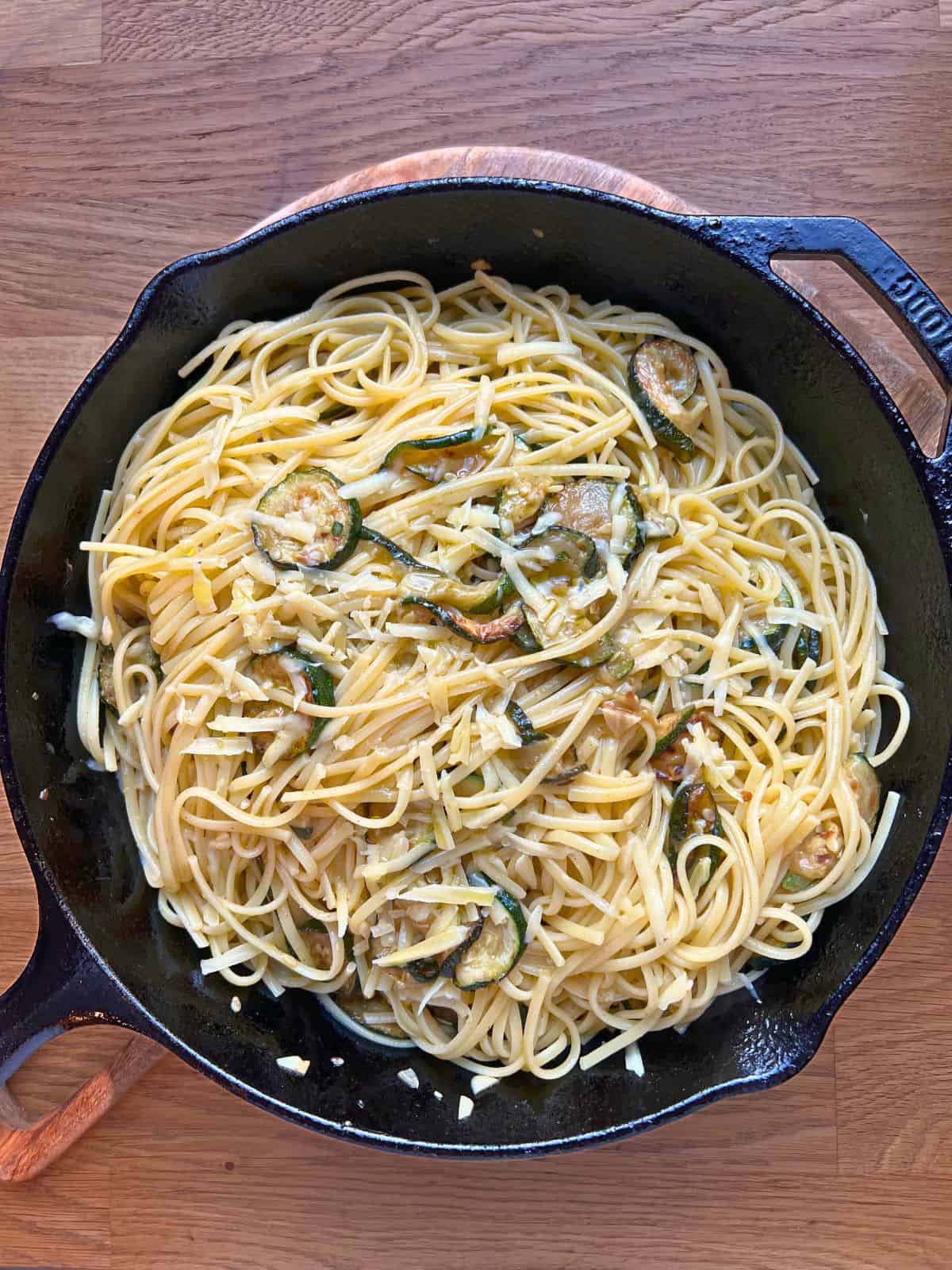 Spaghetti alla Nerano in a large iron skillet.