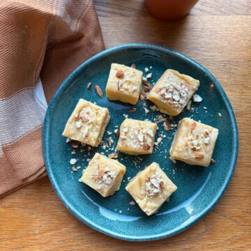 Barfi squares on a small green plate.