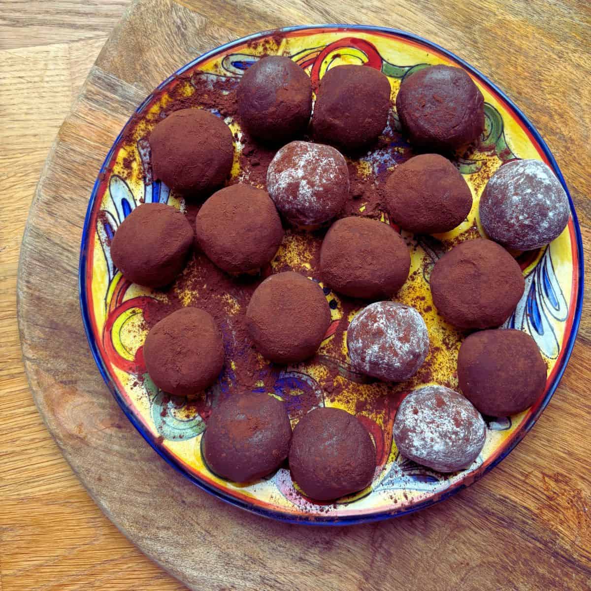 Chocolate fudge balls on painted plate.