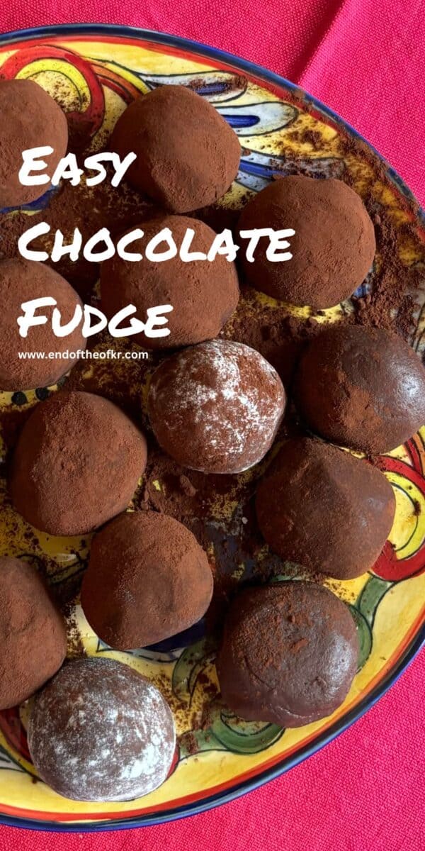 Pin image of chocolate fudge on painted plate on red napkin.