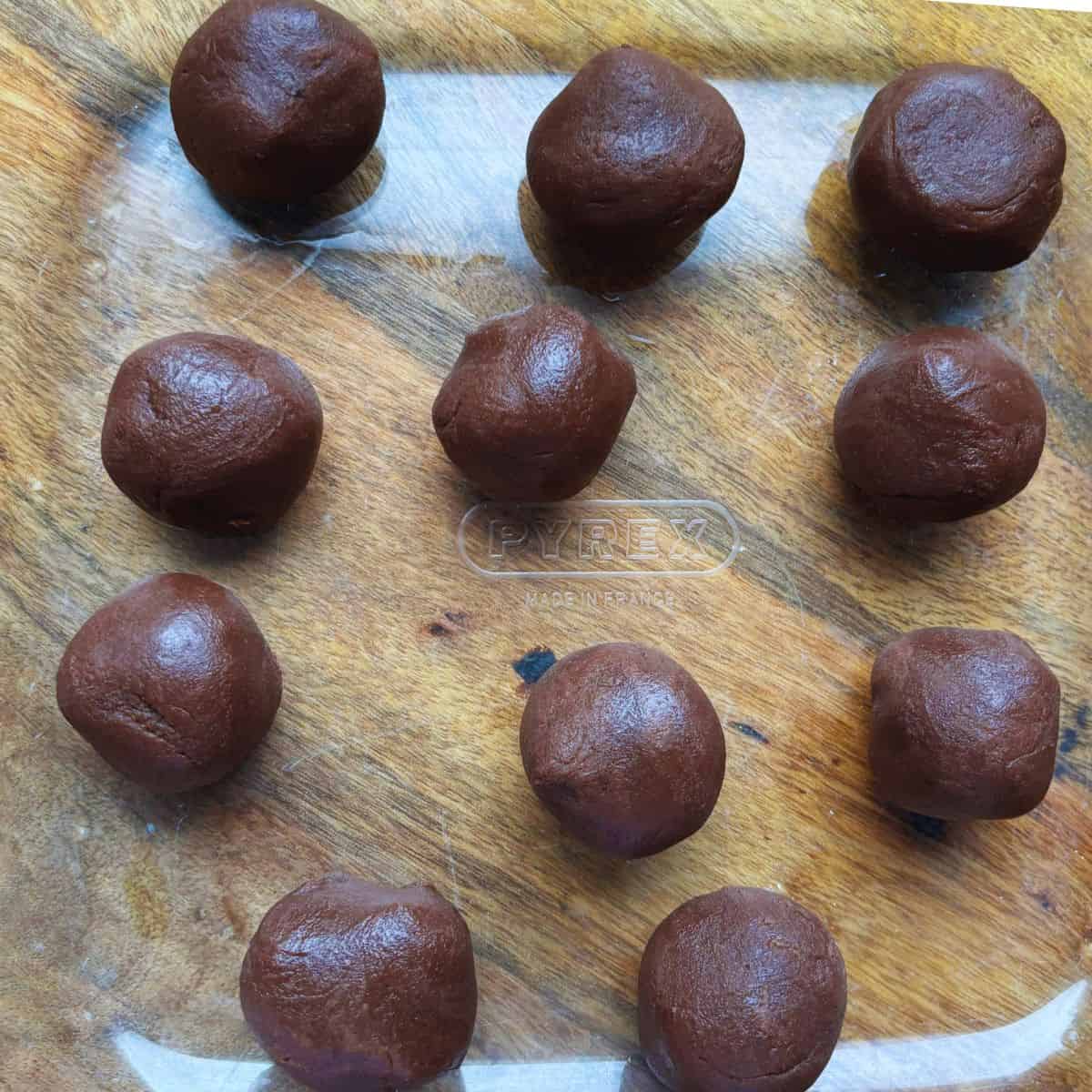 Chocolate fudge balls in a glass dish.