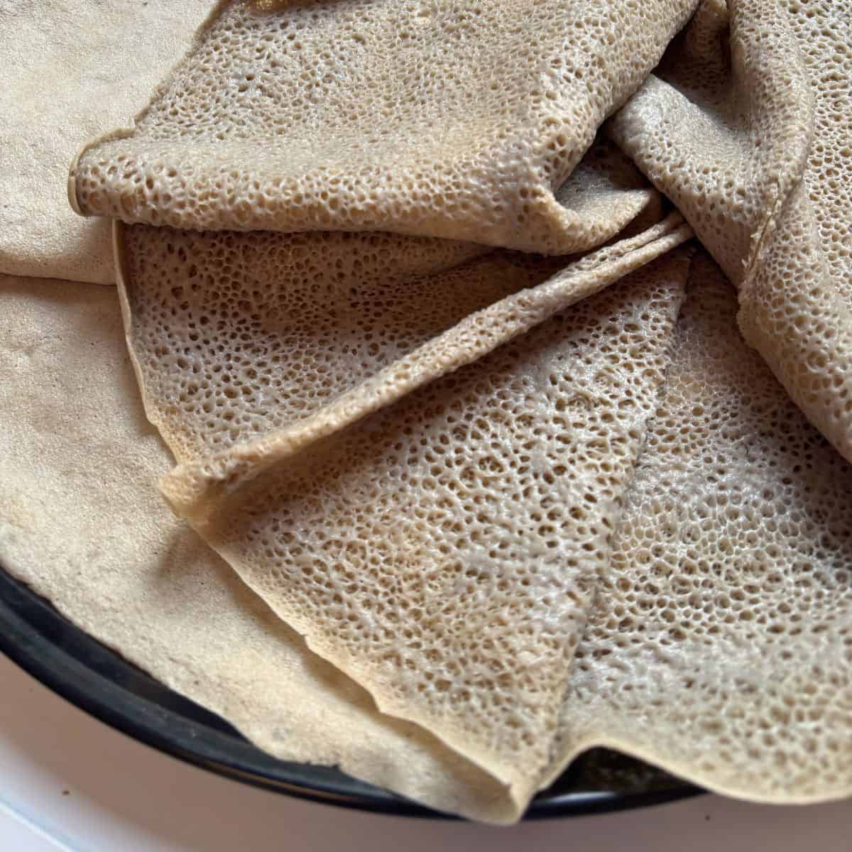 Ethiopian teff flatbread on a tray.